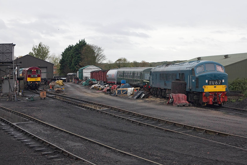 45133, 20227, class 101 DMU & D182 (45045), stabled, Weybourne yard 
 Taken from the train as it leaves Weybourne station looking towards the depot adjacent to the station. From left to right, 45133, 20227, class 101 DMU and D182 (46045) are all on view along with various other stock and spare parts! 45133 was about to leave the line after operating services over the summer season and return to its home at Swanwick Junction for a complete overhaul. 
 Keywords: 45133 20227 class 101 DMU D182 45045 stabled, Weybourne yard