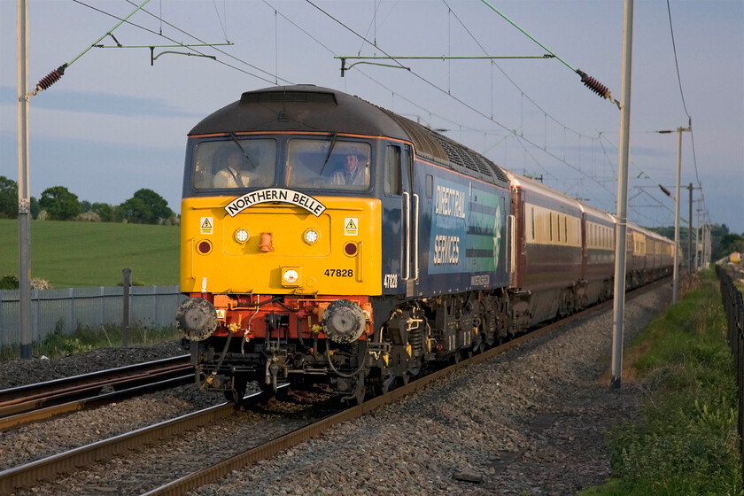 47828, return leg of The Northern Belle, 18.37 Kensington Olympia-Manchester Victoria (1Z59), Milton Malsor SP740553 
 In pretty picture-perfect evening sunshine, the return Northern Belle private charter returns north as the 1Z59 18.37 Kensington Olympia to Manchester Victoria. The train is led by a smart-looking 47828 that, despite being coming up for fifty years old (just the same as myself!), is still earning its keep on the national network! 
 Keywords: 47828 The Northern Belle 18.37 Kensington Olympia-Manchester Victoria 1Z59 Milton Malsor SP740553 DRS Direct Rail Services