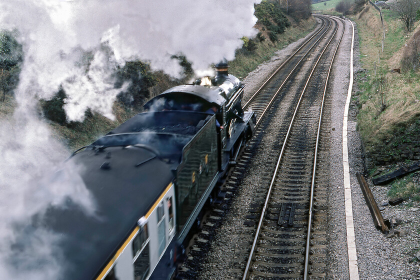 4930, outward leg of The Welsh Marches Express, 10.15 Crewe-Newport, Llanvihangel Summit SO314199 
 My second going-away photograph of the day this time at Llanviangel just north of Abergavenny. With some troublesome motion blur, 4930 'Hagley Hall' leads the outward leg of The Welsh Marches Express. It has just surmounted the summit and will be picking up speed and momentum as it heads south. Notice the microphone out of the first ventilator window looking as though it is wrapped in a white handkerchief acting as a windsheild! 
 Keywords: 4930 The Welsh Marches Express 10.15 Crewe-Newport Llanvihangel Summit SO314199 Hagley Hall