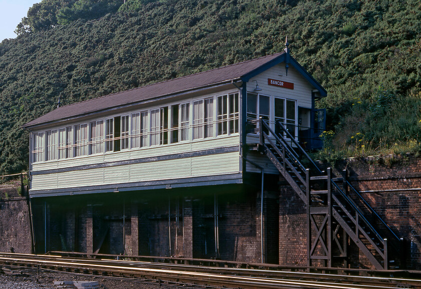 Bangor signal box (LNW, 1923) 
 Compared to when I last visited Bangor station in 2016, see.... https://www.ontheupfast.com/p/21936chg/25632548204/bangor-signal-box back in 1981 I seemed to have had the confidence to wander trackside in order to secure a close-up photograph of the unusually constructed 1923 London and North Western Type 5 signal box. The box was originally designated Bangor Number 2 but when Number 1 was closed and the station layout extensively simplified in the late 1960s it reverted to its simpler name. 
 Keywords: Bangor signal box L&NWR 1923