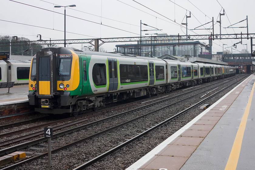 350125 & 350247, LM 08.54 Birmingham New Street-London Euston (2Y60), Northampton station 
 350125 and 350247 wait at Northampton's platform one with the 08.54 Birmingham New Street to Euston. This is our usual train to London when we have one of our days away, but not today as we are heading north to Birmingham. 
 Keywords: 350125 350247 08.54 Birmingham New Street-London Euston 2Y60 Northampton station