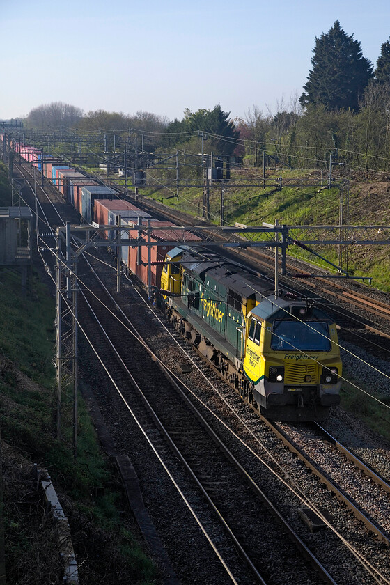 70017, 03.24 Southampton MCT-Trafford Park (4M95, 62L), Victoria bridge 
 A freight service that is not normally seen on this route is seen passing Victoria bridge just south of Roade is the 4M85 03.24 Southampton to Trafford Park led by 70017. This is only my third photograph of this particular locomotive such are their few visits to the WCML route. The train was diverted from its more normal route via Didcot, Oxford and Banbury due to the closure of the Nuneham viaduct just north of Culham. 
 Keywords: 70017 03.24 Southampton MCT-Trafford Park 4M95 Victoria bridge Freightliner