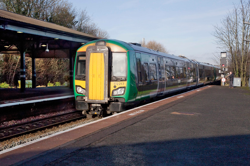 172217, LN 11.46 Dorridge-Great Malvern (2V24, RT), Stourbridge Junction station 
 The sun causes an unfortunate reflection off the windscreen of 172217 forming the 11.46 Dorridge to Great Malvern working as it arrives at Stourbridge Junction station. This station still has many of its classic GWR characteristics and has a nice feel about it. 
 Keywords: 172217 2V24 Stourbridge Junction station