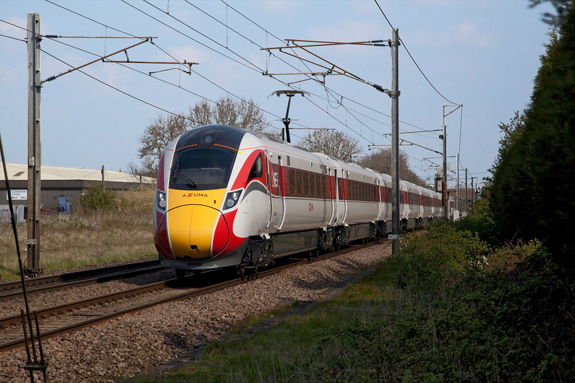 800XXX, 09.41 York-Peterborough (5Q03), Great Northern Inn car park, Carlton 
 The 09.41 York to Peterborough 5Q03 staff training run passes Carlton between Retford and Newark. Unfortunately, I was able to catch the number of this class 800 Azuma as it raced past me heading south. Unlike the HSTs and class 91s that they are to replace in the coming months, their numbers are on the lower bodyside just behind the cab door making them difficult to decipher when passing at speed. 
 Keywords: 800XXX 09.41 York-Peterborough 5Q03 Great Northern Inn car park Carlton