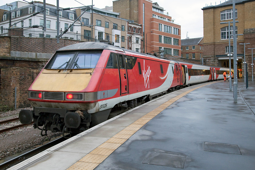 91126, GR 08.30 London King`s Cross-Edinburgh (1S08), London King`s Cross station 
 91126 is still displaying its tail lights in platform zero at London King's Cross. Early passengers will already be boarding the train that will work the 1S08 08.30 to Edinburgh. Unfortunately, the class 91 has been in collision with an item of wildlife as what looks to be a pheasant hangs forlornly on the right hand buffer beam, more rail-kill than road-kill! 
 Keywords: 91126 08.30 London King`s Cross-Edinburgh 1S08 London King`s Cross station