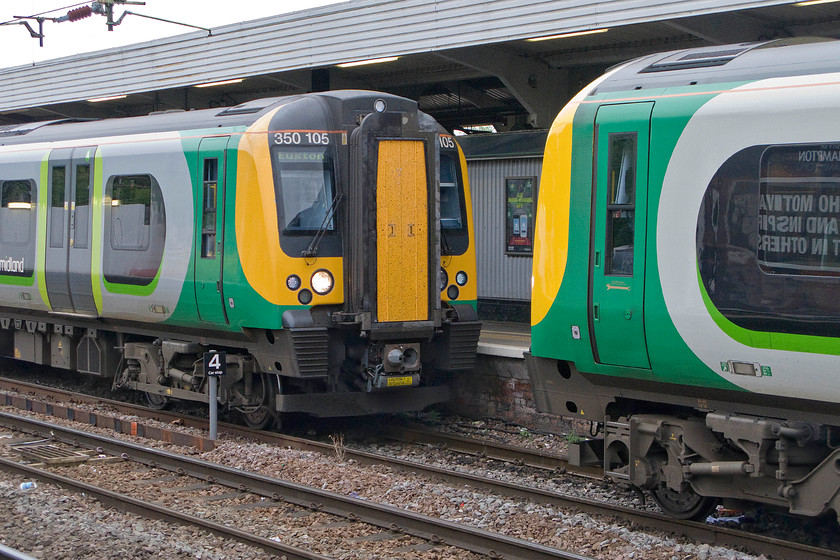 350105 & 350248, LM 07.14 Birmingham New Street-Euston (1Y10), Northampton station 
 350105 inches towards 350248 at Northampton station. Once the Dellner couplings join, the eight-car unit will work forward as 1Y10 to London Euston. 
 Keywords: 350105 350248 07.14 Birmingham New Street-Euston 1Y10 Northampton station London Midland Desiro