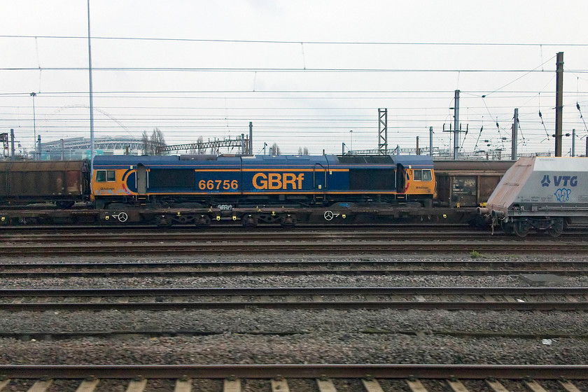 66756, stabled, Wembley Yard 
 A broadside picture of 66756 taken from the train as we pass Wembley Yard. The stadium of the same name can be made out in the gloom in the background. 
 Keywords: 66756 Wembley Yard