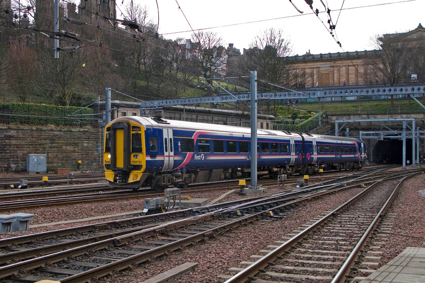 158721, unidentified working, Edinburgh Waverley station 
 ScotRail's 158721 arrives at the western end of Edinburgh Waverley station with an unidentified working. Just behind the leading carriage of the set is the former Waverley West signal box constructed by the LNER in 1936. 
 Keywords: 158721 unidentified working Edinburgh Waverley station Scot Rail