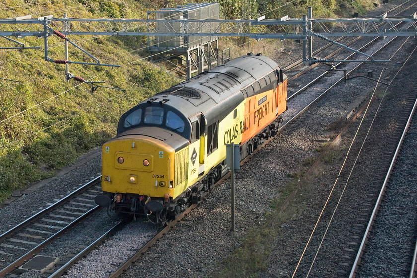 37254, 09.55 Tonbridge West Yard-Derby RTC, Victoria Bridge 
 37254 'Cardiff Canton' heads north past Victoria Bridge between Milton Keynes and Northampton with the 09.55 Tonbridge to Derby RTC light engine move. This is the first time that I have seen this 37 since it has had its Colas Rail Freight livery applied. I am not sure that I like this livery very much but it's fantastic to see these veteran English Electric locos. still earning their keep over 50 years after their introduction. 
 Keywords: 37254 09.55 Tonbridge West Yard-Derby RTC Victoria Bridge