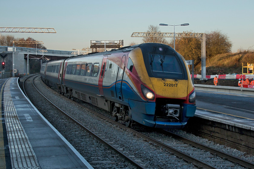 222017, EM 14.41 Corby-London St. Pancras (1P25, 2L), Wellingborough station 
 I really like photographing in winter, at least when the sun is out! However, the conditions do create problems such as are illustrated here. Whilst the sky and the background are bathed in sunshine, the foreground is in deep shade. The camera has a job to know what to do so I tend to take over and manually expose the light areas and take care of the darker areas later on the computer. It is always going to be somewhat of a compromise but with a bit of work some interesting images can be captured. Here at Wellingborough station, 222017 arrives with the 14.41 Corby to St. Pancras. At the moment it comes to a halt on the up fast platform two, but when the relief lines and platforms open, the Corby services will use the new platform four located on the reinstated up slow line. 
 Keywords: 222017 14.41 Corby-London St. Pancras 1P25 Wellingborough station East Midlands Railway Meridian