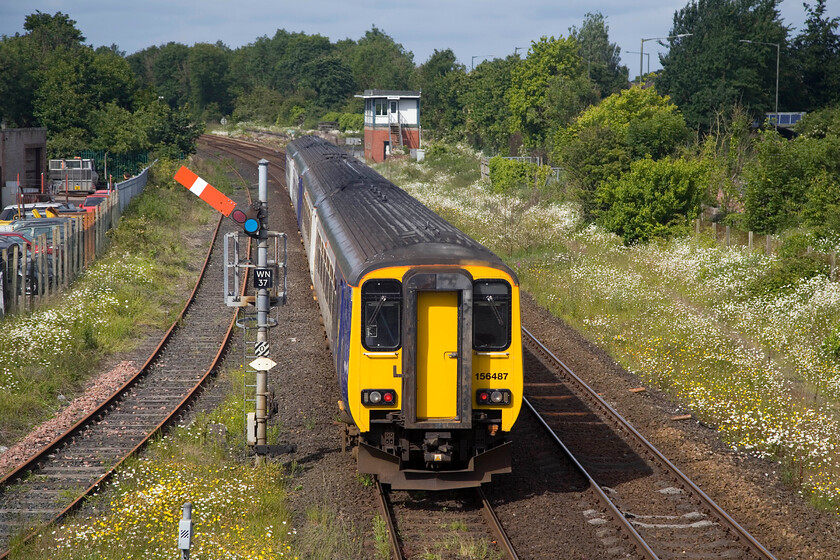 156487 & 156496, NT 09.02 Carlisle-Barrow-in-Furness (2C46, 24L), Wigton station 
 All trains were heavily delayed on the Cumbrian coast route on the day of our visit with some cancellations too. Catching the last of the early morning sunshine at Wigton, 156487 and 156496 depart with the 2C46 09.02 Carlisle to Barrow-in-Furness service. The train is just passing the up starter (WN37) and is about to pass the 1957 built BR standard signalbox. 
 Keywords: 156487 156496 09.02 Carlisle-Barrow-in-Furness 2C46 Wigton station Northern