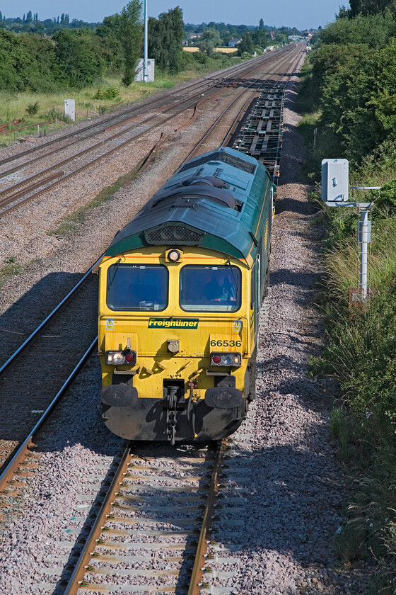 66536, York Yard South-Cricklewood, Lower Farm Road, Bromham TL028518 
 66536 trundles along the up slow line at Bromham near Bedford leading a short rake of freshly overhauled Freightliner flats. I am not sure of the reporting number (unless anybody can advise) but it left York Yard the previous evening and was heading for Cricklewood Yard where the flats would be checked over and pressed straight back into service carrying boxes around the network. 
 Keywords: 66536 York Yard South-Cricklewood Lower Farm Road, Bromham TL028518 Freightliner