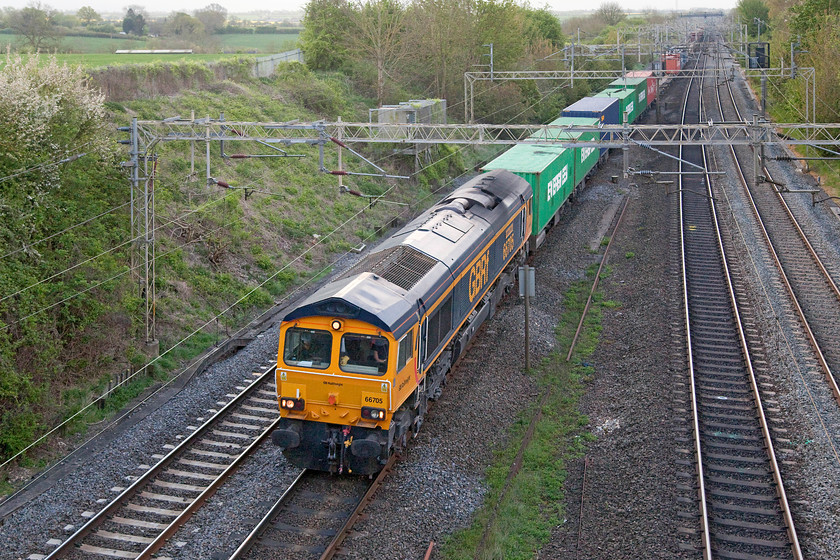 66705, 03.15 Felixstowe North-Trafford Park (4M21), Victoria Bridge 
 66705 'Golden Jubilee' passes an early morning and dull Victoria Bridge just south of Roade on the WCML leading the 4M21 03.15 Felixstowe to Trafford Park Freightliner. Delivered in 2001 it was in service by 2002 and was named to commemorate the Queen's Golden Jubilee in June of that year. At that time it also carried a large union jack on both sides. The locomotive was unveiled on 20th June 2002 at Retford (of all places!) when it took over the 'The Spinnin' State III' railtour. 
 Keywords: 66705 4M21 Victoria Bridge