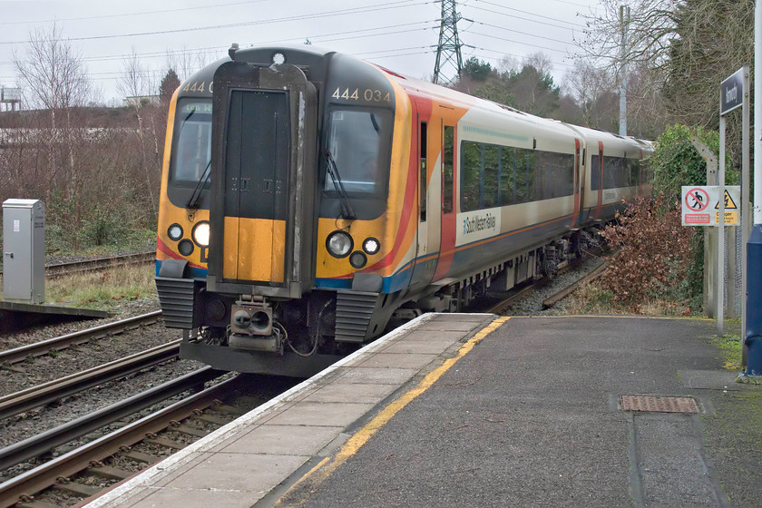 444034, SW 12.20 Weymouth-London Waterloo (1W60, 15L), Hamworthy station 
 444034 drifts into Hamworthy station working the 12.20 Weymouth to Waterloo service. Just off to the left of this image is the two mile Hamworthy branch that extends down to the harbour. Trains still sporadically traverse the branch, in particular, there has been a stone train service operated by DB but, at the time of writing, I am not sure if it still runs? 
 Keywords: 444034 12.20 Weymouth-London Waterloo 1W60 Hamworthy station