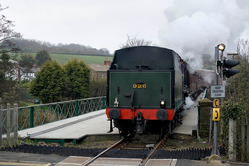 926, 09.19 Grosmont-Whitby (1T10, 7L), Ruswarp station 
 This was one of those situations when as we approached the level crossing in the car, the barriers went down and we had no time to get to a decent spot so it's a bit of a head-on shot of a tender first working. However, it's one worth taking and keeping as it's the first time that I have seen fare paying scheduled steam hauled service on the network. Maunsell designed 4-4-0 'V Class' better known as the 'Schools Class' number 926 'Repton' crosses the River Esk on the approach to Ruswarp station. It is working the NYMR's 1T10 09.19 Pickering to Whitby. On arrival at Whitby, just over a mile away, the locomotive will round round ready to lead the return Pickering service. 
 Keywords: 926 09.19 Grosmont-Whitby 1T10 Ruswarp station