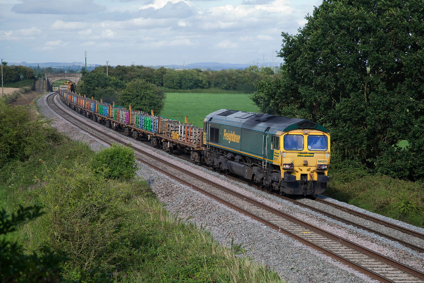 66511, 13.48 Twyford West-Fairwater Yard HOBC (6C73), Berkley ST802494 
 In a welcome burst of sunshine, 66511 leads the 13.48 Twyford to Taunton Fairwater Yard HOBC (High Output Ballast Cleaner) 6C73 working past Berkley just east of Frome. 
 Keywords: 66511 13.48 Twyford West-Fairwater Yard HOBC 6C73 Berkley ST802494