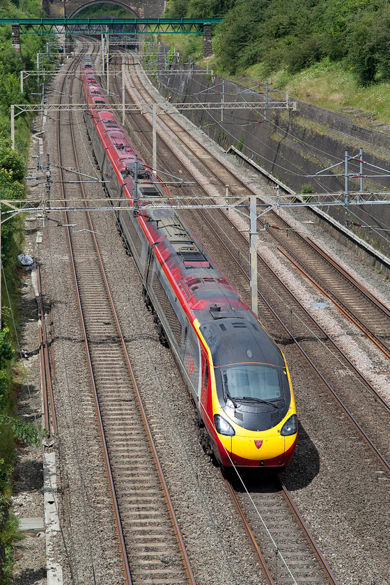 390119, VT 12.50 Birmingham New Street-London Euston (1B46), Roade Cutting 
 the 12.50 Birmingham New Street to London Euston 1B46 passes through Roade Cutting formed by 390119 'Virgin Warrior'. 
 Keywords: 390119 12.50 Birmingham New Street-London Euston 1B46 Roade Cutting