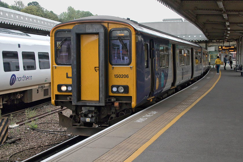 150206, NT 12.02 Sheffield-Leeds (2L14, 4E), Sheffield station 
 150206 is about to get underway from Sheffield with the 12.02 to Leeds. Surprisingly, this unit is a photographic cop as it was a West Country unit operated by FGW. I managed a lot of photographs of these units in various locations but not this one! 
 Keywords: 150206 12.02 Sheffield-Leeds 2L14 Sheffield station Northern