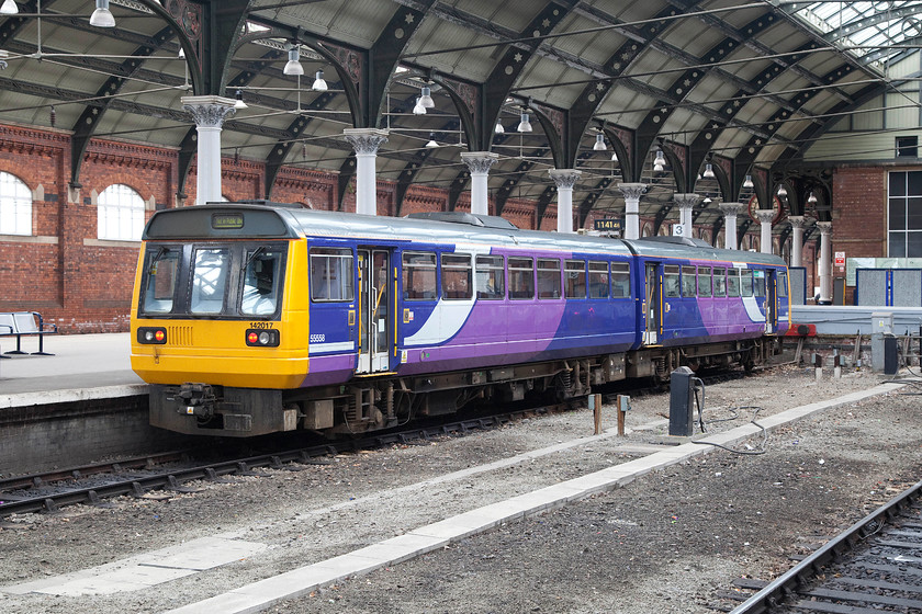 142017, NT 12.32 Darlington-Saltburn (2D32), Darlington station 
 Currently showing 'not in service' on its destination blind, 142017 sits in one of Darlington's up facing platforms. A little later in the afternoon, it will work the 2D32 12.32 to Saltburn. 
 Keywords: 142017 12.32 Darlington-Saltburn 2D32 Darlington station