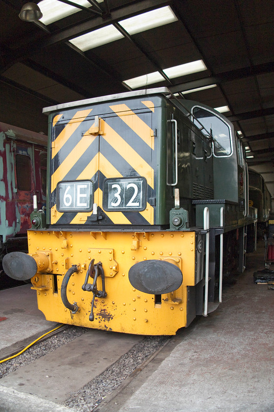 D9539, stabled, Rowsley depot 
 Inside Rowsley repair and maintenance shop is D9539. This is one of the many class 14s that have entered preservation. So, one of British Railways' disasters with all the class being withdrawn five years after their introduction, has been turned into a major success in the preservation world. After its short stint the mainline, D9539 was used at Corby hauling heavy iron ore trains on their internal tracks, many of which were un-ballasted. 
 Keywords: D9539 Rowsley depot