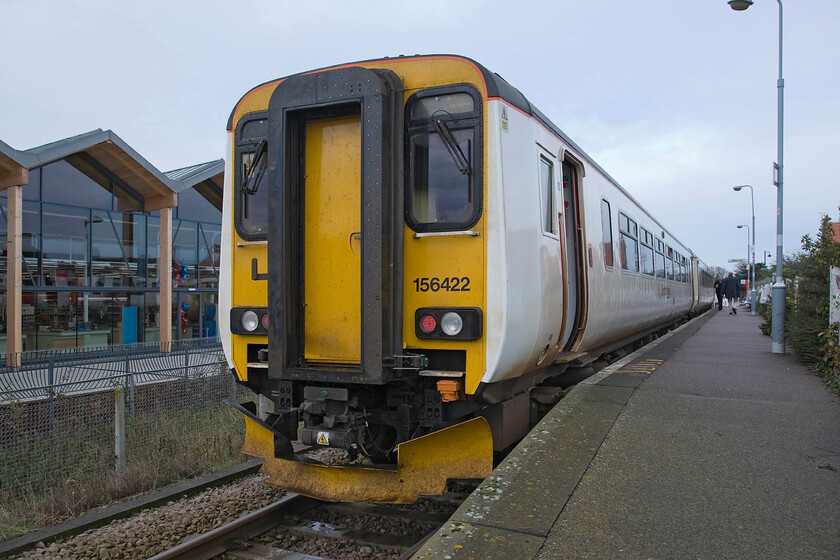 156422, LE 09.45 Sheringham-Norwich, Sheringham station 
 The platform is so short at Sheringham that in order to take a photograph of a two-car unit I had to nip (without the driver seeing me) down the ramp in order to get it all in. With the recently opened Tesco store in the background, 156422 will soon work the 09.45 service to Norwich. My wife, son and I travelled on this to journies end. 
 Keywords: 156422 09.45 Sheringham-Norwich Sheringham station Greater Anglia GA