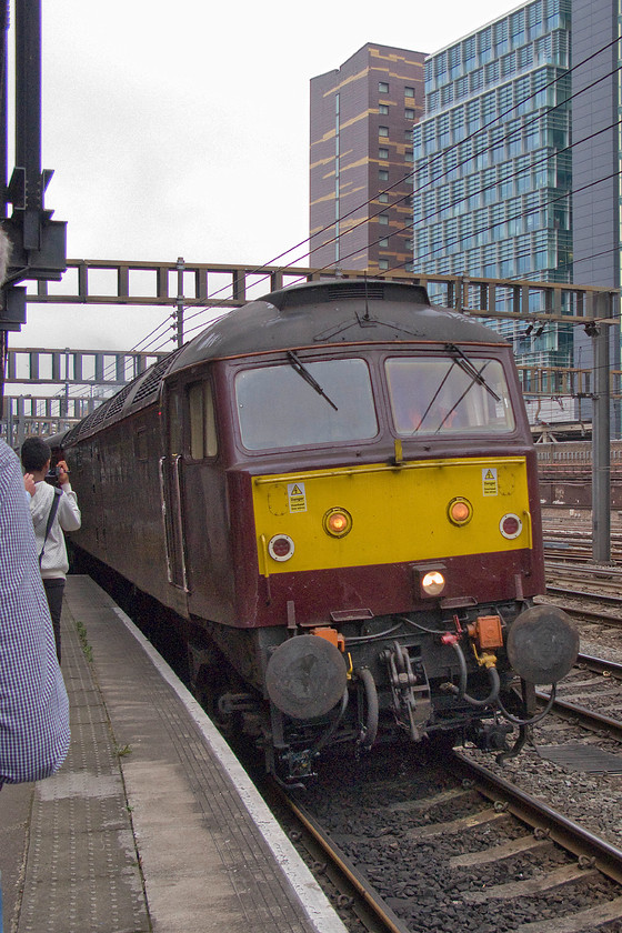 47746, 05.06 Southall-London Paddington ECS (5Z70), London Paddington-station 
 With the platform end being a little overcrowded, taking a decent picture of 47746 leading the 05.06 Southall to Paddington ECS working into the station was somewhat difficult. As usual, the drab WCR livery applied to 47746 looks even worse on what is a very grey summer's morning. 
 Keywords: 47746 05.06 Southall-London Paddington ECS 5Z70 London Paddington-station WCR West Coast Railways