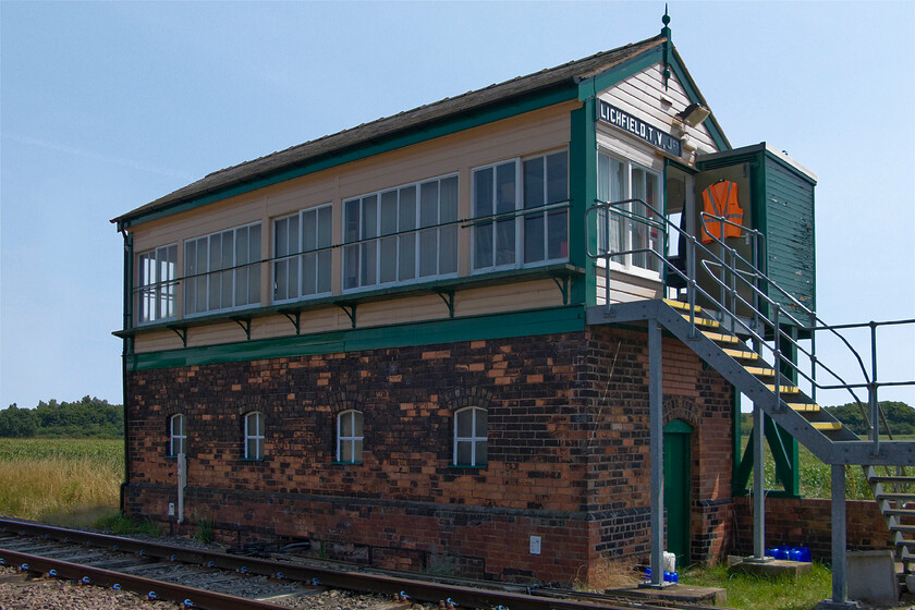 Lichfield TV Junction signal box (LNWR, 1897) 
 The impressive former L&NWR signal box basks in the hot summer sunshine just near to Lichfield station. The box was built in 1897 on the line between Wichnor Junction and Birmingham via Sutton Coldfield. Passenger services now terminate a short distance to my right at the Lichfield high-Level station that straddles the WCML below it. The line beyond the station past where I am standing is freight only but sees fairly light traffic. There is also a short, steep and tight spur on to the WCML in the northerly direction. 
 Keywords: Lichfield TV Junction signal box