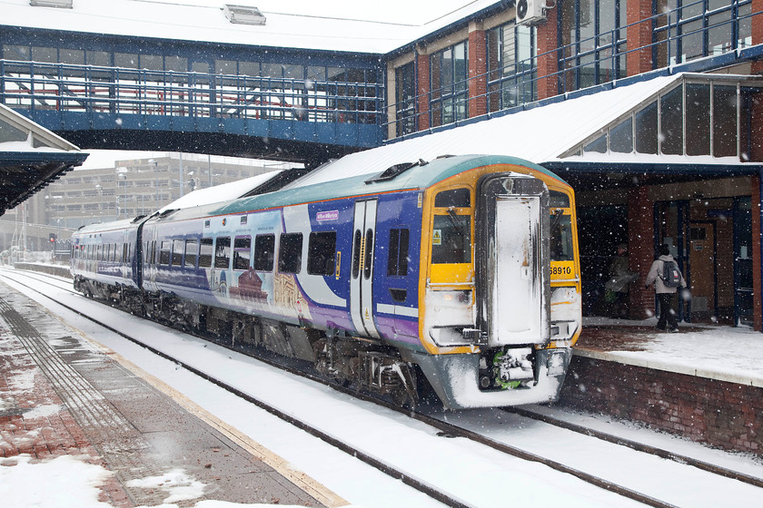 158910, NT 11.06 Sheffield-Leeds (2L26, 20L), Barnsley station 
 A snow-bound Barnsley station sees 158910 arrive working the 11.06 Sheffield to Leeds working. The roads were very quiet (thankfully) with not many people venturing out but the railways were doing a good business. 
 Keywords: 158910 2L26 Barnsley station