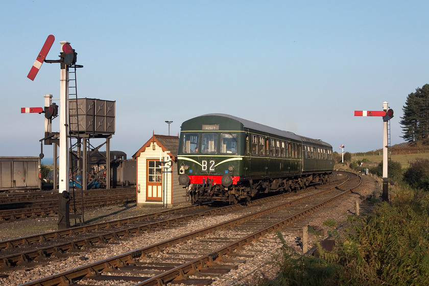 M51192 & M56352, 15.35 Holt-Sheringham, Weybourne station 
 With the sun getting low in the afternoon sky, M51192 and M56352 leave Weybourne station with the 15.35 Holt to Sheringham. The four matching Great Northern summersault signals add to the authenticity of the scene along with the water tower and small yard signal cabin. 
 Keywords: M51192 M56352 15.35 Holt-Sheringham Weybourne station