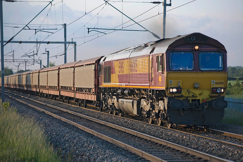 66005, 16.57 Halewood-Southampton Western Docks (6O42), Milton Malsor SP740553 
 Seemingly working hard on the steady climb out of Northampton 66005 heads the 16.57 Halewood to Southampton Western Docks loaded car train past Milton Malsor. The side-skirted double-decker cartics will be conveying high-value left-hand drive JLR products to the continent for onward movement to various countries. 
 Keywords: 66005 16.57 Halewood-Southampton Western Docks 6O42 Milton Malsor SP740553 EWS