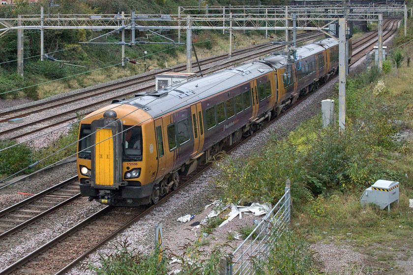 172336, 14.12 Tyseley LMD-Ilford EMUD (5Q50, 15L), site of Roade station 
 172336 bangs its way along the West Coast mainline passing Roade as the 14.12 Tyseley to Ilford 5Q50. Judging by the row it was making it had a severe wheel flat on the leading bogie that would have made for an unpleasant journey for the driver in the cab. It was making the long journey to Ilford to take advantage of their wheel turning lathe which, I believe, is the only one in existence now in the south of the country. What a shocking indictment of our 'modern' railway! 
 Keywords: 172336 14.12 Tyseley LMD-Ilford EMUD 5Q50 site of Roade station West Midlands Railway WMR