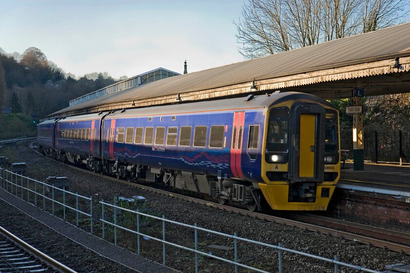 158950, GW 12.30 Cardiff Central-Portsmouth Harbour (1F17), Bath Spa station 
 Withe sun now sinking down behind the ridge that lines Bath to the south only the upper half of 158950 is in full light with the rest in deep shade and it's only 14.30! 158950 is working the 12.30 Cardiff to Portsmouth Harbour and is seen leaving the station. In my earlier spotting days, a service such as this would have been worked by a Class 33 hauling a rake of Mk. I stock, for example see....... https://www.ontheupfast.com/p/21936chg/29805504204/x33025-bristol-temple-meads-cardiff 
 Keywords: 158950 12.30 Cardiff Central-Portsmouth Harbour 1F17 Bath Spa station First Great Western super sprinter