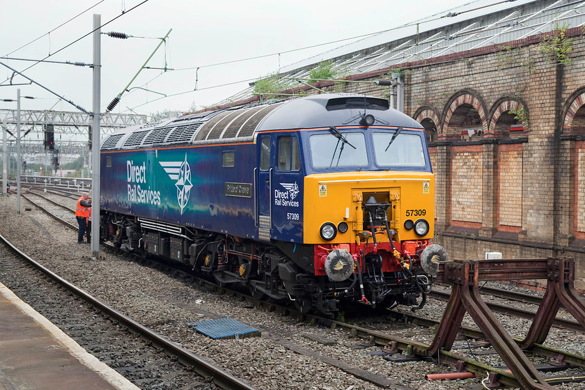 57309, stabled, Crewe station 
 Whilst waiting for our train that would take us from Crewe to Edinburgh, former Virgin Thunderbird 57309 'Pride of Crewe' was receiving some attention. When it was operated by Virgin West Coast this 57 was in a more familiar red livery and named 'Brains'. In a much earlier guise, as 47254, I photographed the locomotive on a PW train stabled in Arle loop at Cheltenham in March 1985. 
 Keywords: 57309 Crewe station