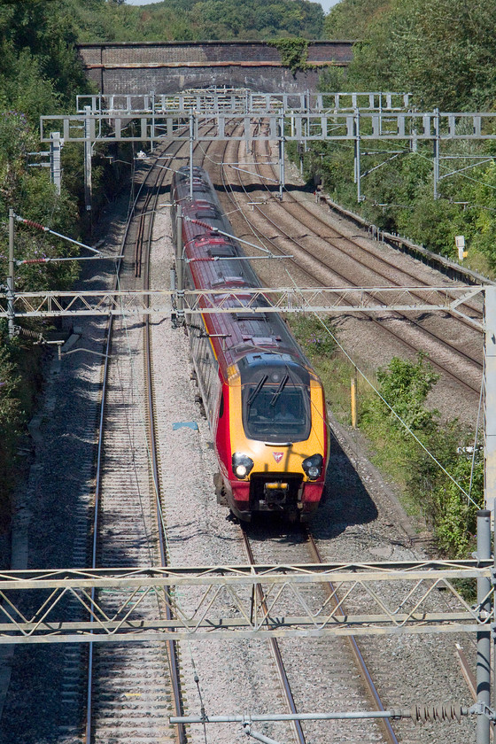 Class 221, VT 11.35 Chester-London Euston (1A28), A508 bridge 
 A class 221 slows to walking pace as it approaches freshly laid ballast forming the 11.35 Chester to London Euston. The picture is taken from the A508 road bridge in the village of Roade. 
 Keywords: Class 221 11.35 Chester-London Euston 1A28 A508 bridge