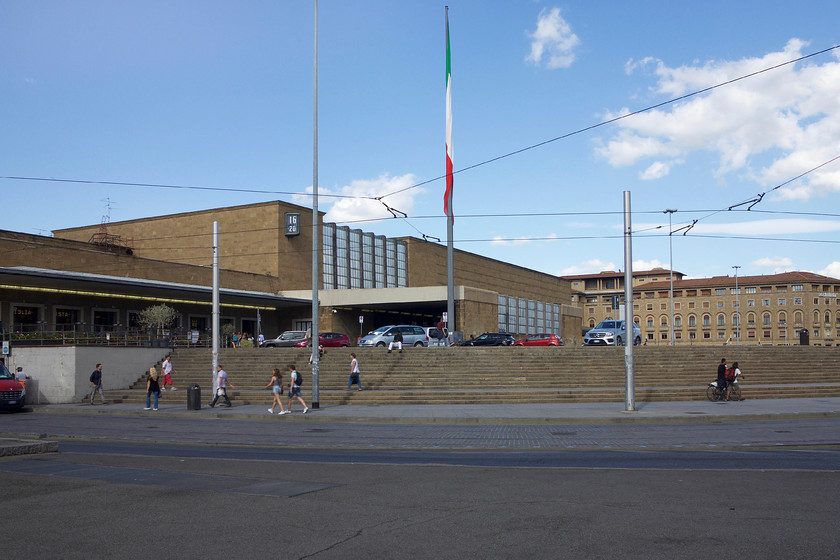 Frontage, Florence SMN station 
 The rather brutalist but functional frontage of Florence Santa Maria Novella station. It was rebuilt in 1934 being moved further away from the church from which it gets its name. It is built to the Italian Modernism model being designed by a number of architects known as the Gruppo Toscano (Tuscan Group). Unfortunately, I cannot help feeling a little uncomfortable praising the station given that it was conceived and built under the orders of the facist dictator Mussolini. This was a dark time in Italy's past and one I don't like celebrating even if it is through its architecture. 
 Keywords: Frontage Florence SMN station