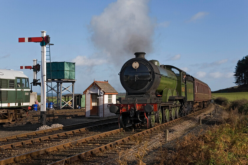 8572, 10.30 Sheringham-Holt & D5631, stabled, Weybourne station 
 LNER B12 8572 makes a fine sight as it arrives at Weyborune station working the 10.30 Sheringham to Holt service. Bringing a train into the station from the east is quite tricky as it requires a short burst of steam, as can be seen in the photograph, for the few hundred yards into the platform as the gradient rises quite sharply after a short decent just before the yard. Added to this is that the driver arrives blind into the platform due to the curve of the track. To the left is another locomotive synonymous with the railways of East Anglia, A1A A1A Type 3 (Class 31) D5631. 
 Keywords: 8572 10.30 Sheringham-Holt D5631 stabled, Weybourne station LNER B12