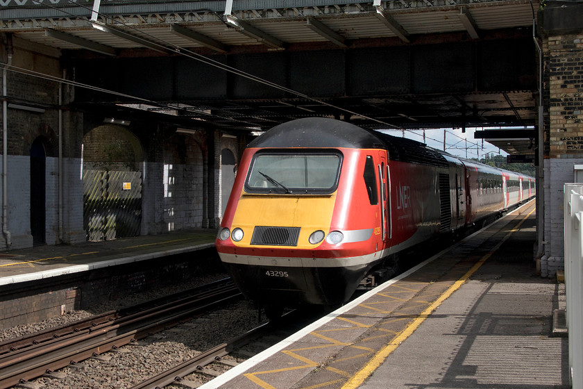 43295, GR 15.06 London King`s Cross-York (1N87, 7L), New Southgate station 
 43295 just gets its nose into the afternoon sunlight at New Southgate station as it heads north leading the 15.06 King's Cross to York 'stopper'. As 43095, this power car was introduced in September 1978 as part of east coast set 254020. Its work, racing up and down the ECML, is almost done some forty-one years later as withdrawal beckons in the comming few months. 
 Keywords: 43295 15.06 London King`s Cross-York 1N87 New Southgate station