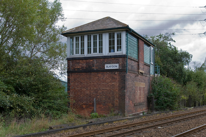 Blaydon signal box (NE, not known) 
 Blaydon signal box is a NER Type N2 design with a Mckenzie & Holland forty-three lever frame. It is a little incongruous from this angle appearing to face the wrong way. Its front now faces trees where once there were the lines of the former passenger route via Scotswood railway bridge and Elswick to Newcastle Central with the lines in the foreground being the former freight-only route towards Dunston and then Gateshead. The former route was closed by BR in 1982 with all traffic diverted to the latter. 
 Keywords: Blaydon signal box North Eastern Railway