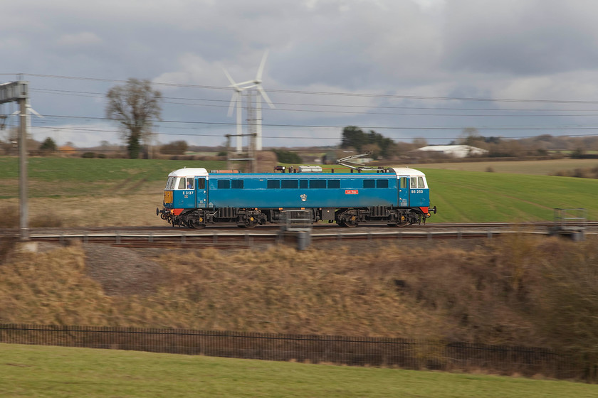 86259, 13.17 Acton Lane Reception Sidings-Rugby CS LE (0Z88), Roade Hill 
 Using a 1/125th sec. shutter speed and the pan-shot technique the movement of 86259 'Peter Pan' has been captured as it passes Roade Hill just north of Hanslope Junction. The vintage class 86 was returning to its stabling point in the old Rugby Carriage Sidings following hauling the The Winter Cumbrian Mountain Express charter the previous day. It was running as 0Z88, the 13.17 Acton Reception Sidings to Rugby CS. 
 Keywords: 86259 Peter Pan Les Ros light engine 0Z88 Roade Hill