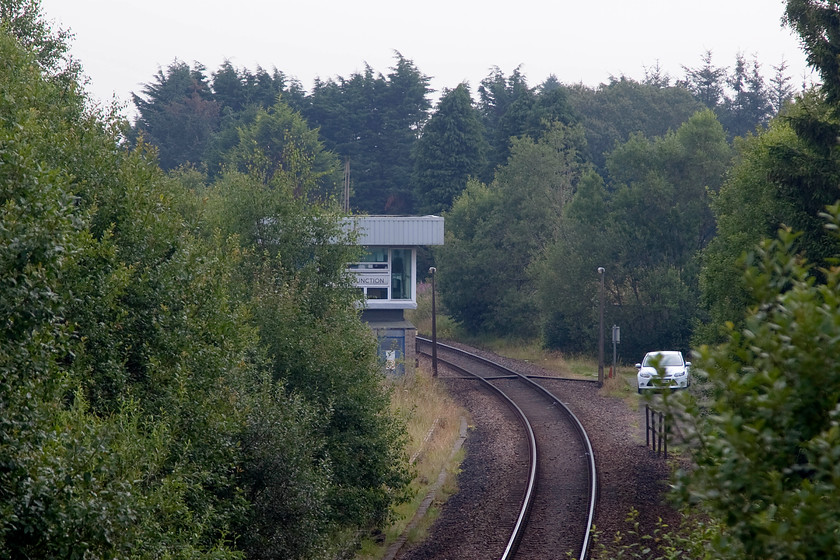 Stanley Junction signal box (BR, 1961) 
 A very poor photograph of Stanley Junction signal box located between Perth and Dunkeld. It is the fringe box north of the area controlled by the Scottish signalling centre and represents a huge change from twenty-first-century technology to that of the Victorian era. The box was constructed in 1961 by British Railways at the junction where the former North British line to the Angus coastal route via Forfar diverged. Be warned, if you ever wish to visit this spot, the local farmer was not very welcoming making a huge fuss about us parking our hire car by the side of the road on a piece of his land, it was there for all of five minutes! 
 Keywords: Stanley Junction signal box (BR, 1961)