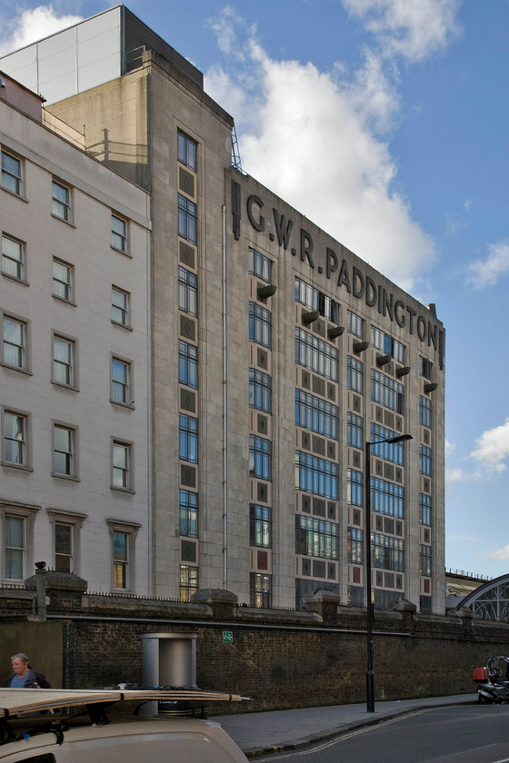 Side view from London Street, Paddington station 
 A side of Paddington station rarely viewed by passers-by is the one seen from London Street that leads to the new taxi rank at the far end of the northern side of the station. The large lettering atop the building is a slightly later typeface used during the period 1934 to 1942 that is similar but not the same as the commonly associated Swindon Egyptian version used a little earlier. 
 Keywords: Side view from London Street Paddington station