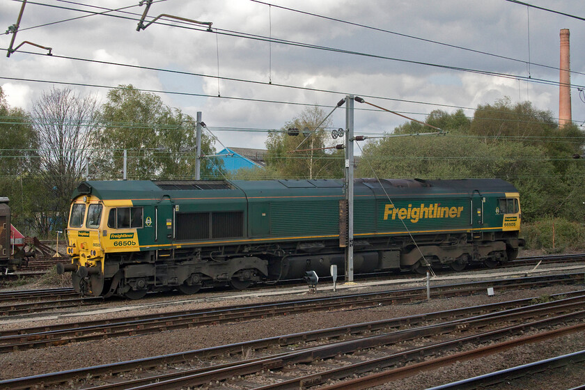 66505, stabled, Doncaster Belmont Yard 
 Doncaster has developed into an absolute mecca when it comes to freight and locomotive spotting. As one enters the town by train from the south there is too much to look out for with yards and sidings on all sides simply covered with interesting things! I managed to take this 'grab' photograph of 66505 from the vestibule window of the Azuma as we passed through Belmont Yard. It appeared to be either backing on to or coming off a Freightliner service. 
 Keywords: 66505 stabled Doncaster Belmont Yard