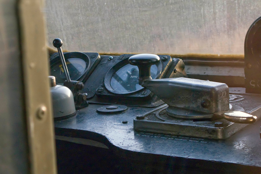 Driver`s desk, M51192, 15.45 Sheringham-Holt, between Sheringham & Weybourne 
 The driver's control desk of M51192 is seen through the bulkhead window as the 15.45 Sheringham to Holt approaches Weybourne. Behind the power controller is the speedometer, close examination reveals that the train is travelling at the prerequisite maximum twenty-five miles per hour speed for heritage lines. 
 Keywords: Driver`s desk M51192 15.45 Sheringham-Holt between Sheringham & Weybourne Class 101 DMU