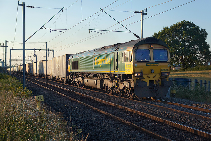 66505, 18.58 Lawley Street-Felixstowe North (4L73), Milton Malsor 
 I love the light of a warm summer's evening as the sun gets down to the horizon. It picks out detail that is not visible during the day when the sun is high overhead and very strong. 66505 brings the 4L73 18.58 Lawley Street (Birmingham) to Felixstowe North Freightliner past Milton Malsor just south of Northampton. This train was well loaded with the class 66 working hard on the 1:200 gradient towards Roade. 
 Keywords: 66505 18.58 Lawley Street-Felixstowe North 4L73 Milton Malsor