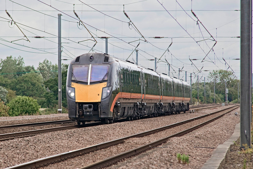 Class 180, GC 07.54 Bradford Interchange-London Kings Cross (1A70, 2L), Offord DArcy TL213655 
 One of Grand Central's class 180s speeds southwards past Offord DArcy with the 07.54 Bradford Interchange to King's Cross. This picture is taken from the security of a caged foot crossing complete with mini colour lights to inform pedestrians if it's safe to cross. 
 Keywords: Class 180 1A70 Offord DArcy TL213655