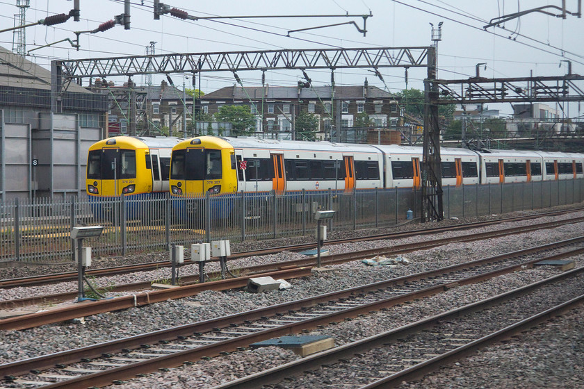 378201 & 378207, stabled, Willesden TMD 
 As our train slowed to take the cross-London line at West London Junction 378201 and 378207 sit in Willesden depot. 
 Keywords: 378201 378207 Willesden TMD