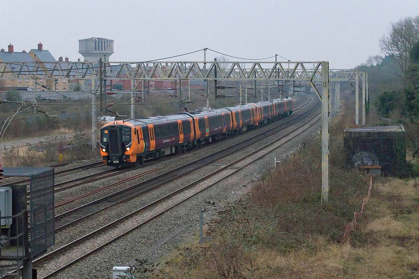 730018 & 730035, 14.18 Bletchley CS-Northampton EMD (5N99, 18E), site of Roade station 
 I am not sure as to why this 5N99 was taking place seeing 730018 and 730035 running from Bletchley to Northampton EMD at Kings Heath. It is seen passing Roade with a large X posted in the front window indicating a coupling fault on that end of the unit so could that be the reason for its short journey to the depot? 
 Keywords: 730018 730035 14.18 Bletchley CS-Northampton EMD 5N99 site of Roade station West Midlands Trains