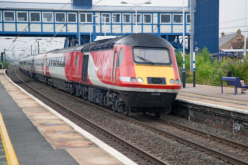 43296, GN 10.00 London Kings Cross-Aberdeen (1S11, 2E), St 
 43296 heads north through St. Neots station working the 1S11 10.00 King's Cross to Aberdeen. This 523-mile journey is one of the longest on the network and one ably carried out by these forty-year-old veterans but not for much longer. 
 Keywords: 43296 1S11St. Neots station