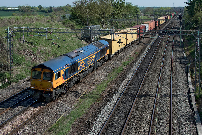 66760, 10.36 Felixstowe North-Hams Hall (4M23, 2L), Victoria bridge 
 GBRf's 66760 'David Gordon Harris' leads the 10.36 Felixstowe to Hams Hall that stretches off into the distance at Victoria bridge just south of Roade. Unusually for these strange COVID-19 times, this train arrived late! Having said this, it was only two minutes adrift but when many freights were arriving over an hour early this one stuck out somewhat! 
 Keywords: 66760 10.36 Felixstowe North-Hams Hall 4M23 Victoria bridge David Gordon Harris