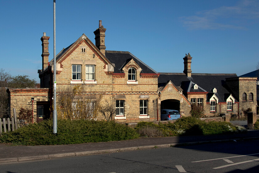 Frontage, Potton station (closed 01.01.68) 
 The typical yellow gault brickwork of the former Potton station looks impressive in the springtime sunshine and is typical of many such structures found in the eastern counties. For a relatively small village, the building is large with it seeing much outward traffic from the surrounding agricultural land during its heydey. Interestingly, it also saw large amounts of manure arriving at a facility near the station courtesy of London Zoo's stables that no doubt did not go unnoticed by the local residents! Located on the Varsity route the station shut along with the line closed on 01.01.68. Whilst this station will not reopen there are grand and ambitious plans to resurrect the line between Oxford and Cambridge but the preferred route appears to go north of Potton so the village looks as though the railway will not return. 
 Keywords: Frontage, Potton station